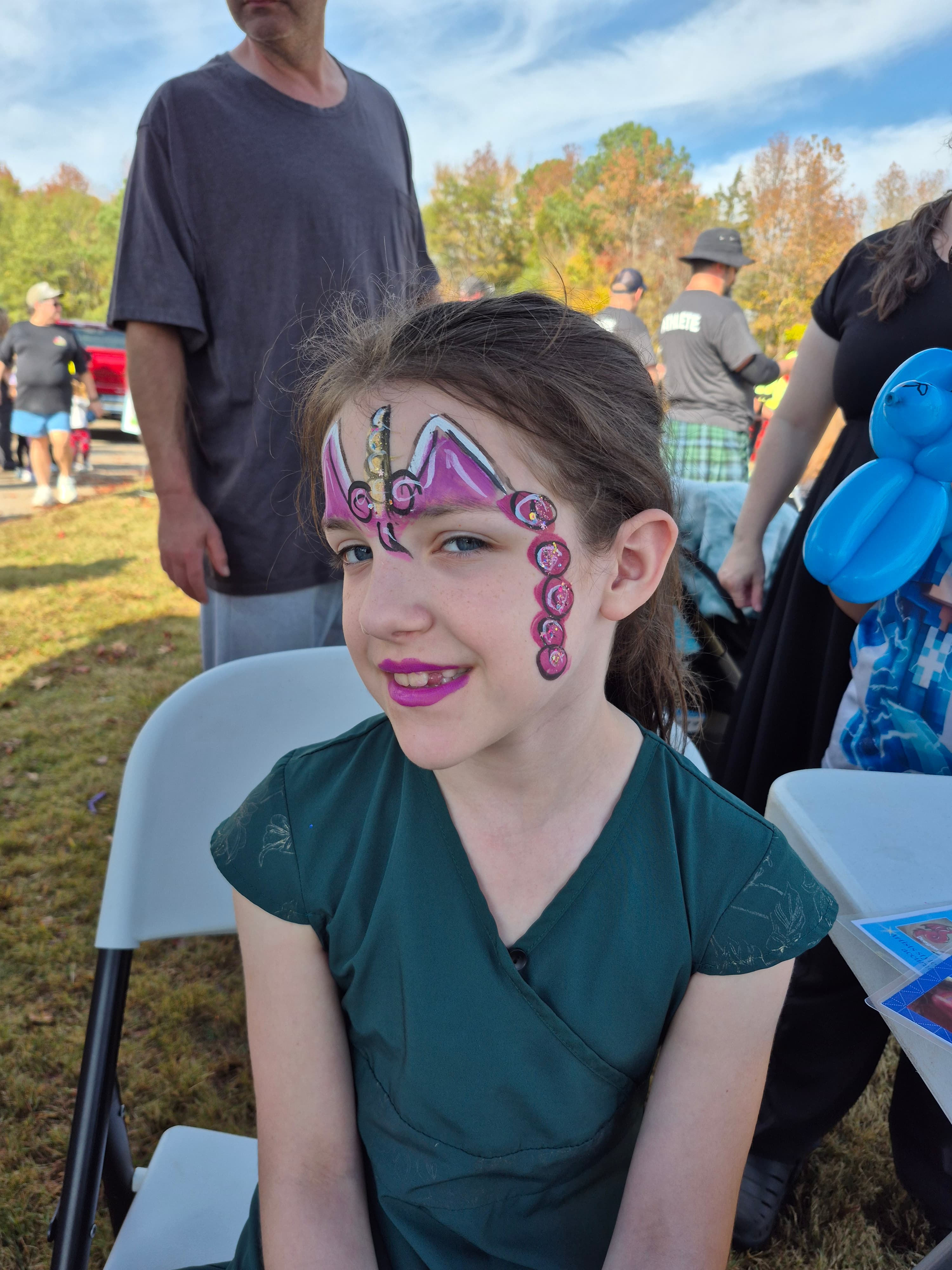 Colorful face painting at Charlotte event